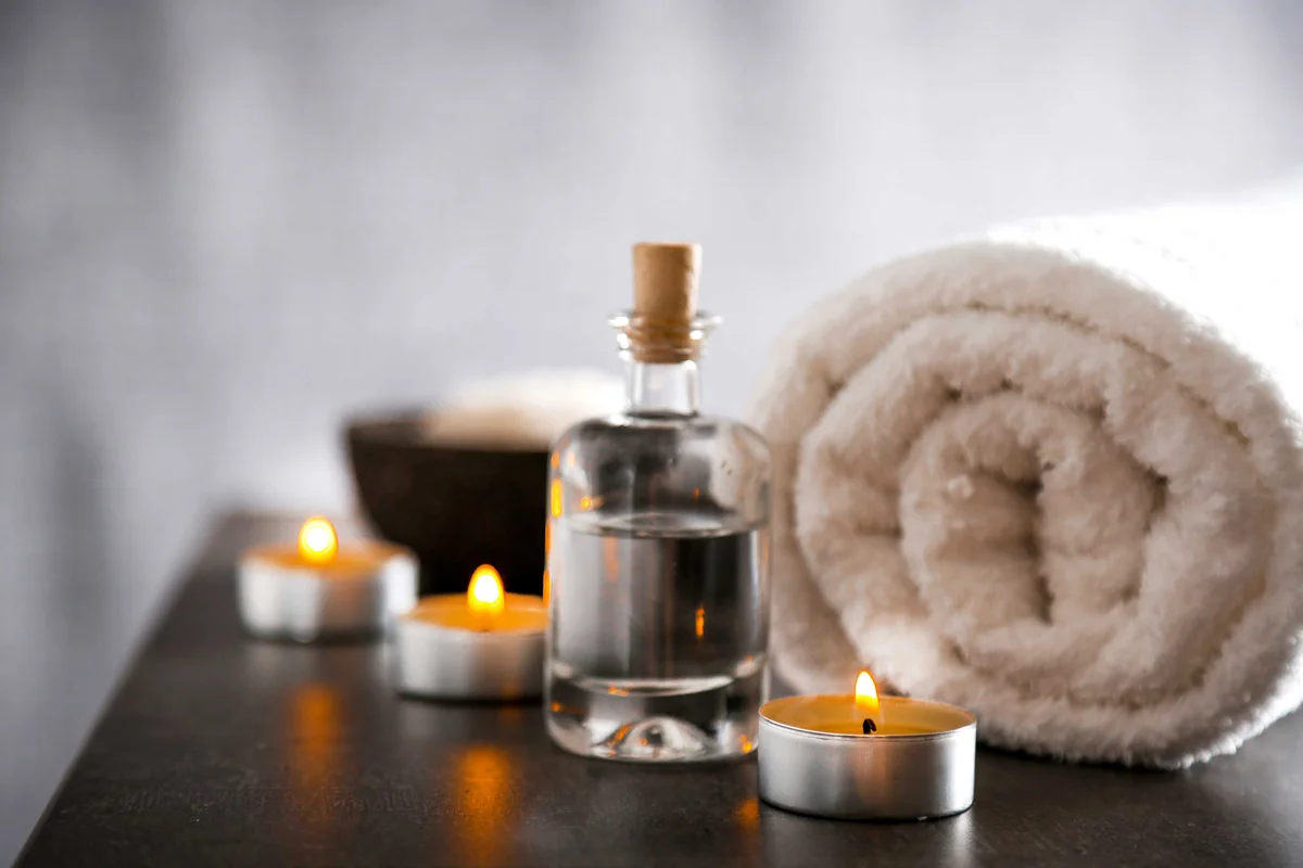 Composition of spa treatment on table colorful background